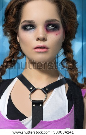 Fashion Runk Style Model Girl Portrait. Hairstyle. Punk Woman Makeup with bruise