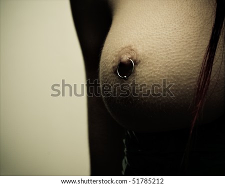 stock photo : Female nipple piercing