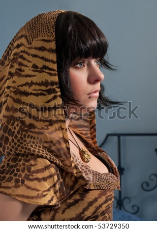 Portrait of young woman in tiger pattern hood