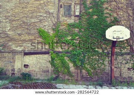 An old playground with broken basketball hoop