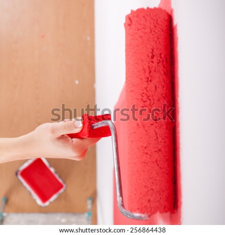 Hand painting wall in red