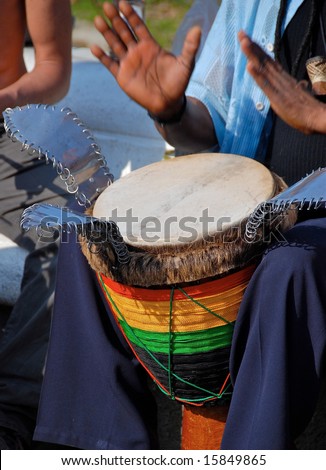 Man beats a rhythm on a drum