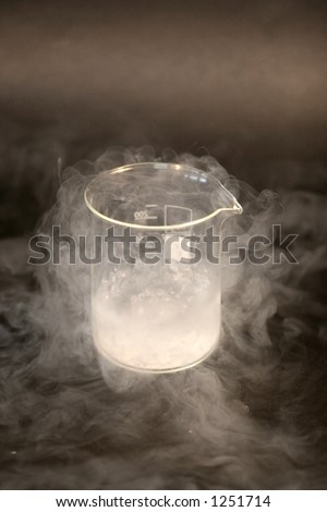 Liquid nitrogen in a glass on a black background