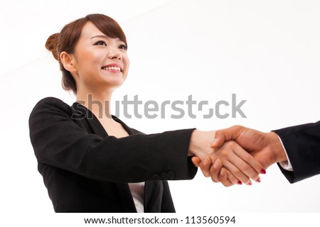 Business woman shaking with someone.