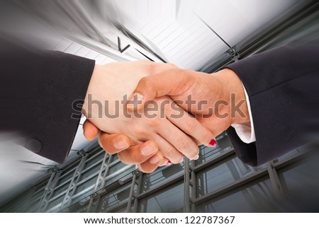 Handshake men and women in business background.