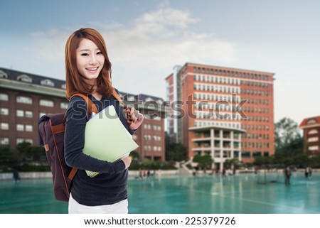 Young Asian student  outdoor shot with campus background.