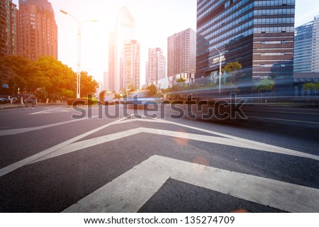 the light trails on the modern building background in shanghai china the light trails on the modern building background in shanghai china
