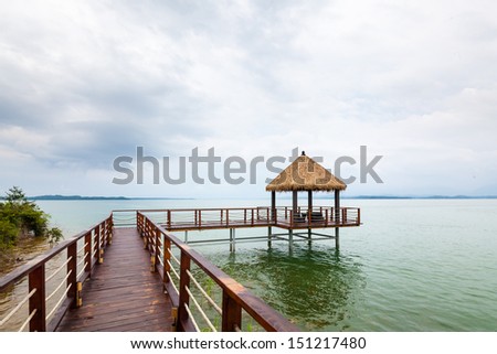 Wooden jetty over the beautiful  with blue sky