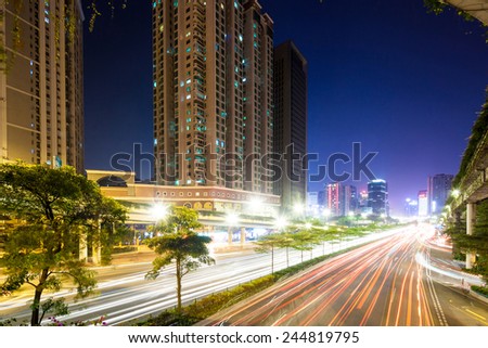 light trails on city road at night in guangzhou , rush hour traffic
