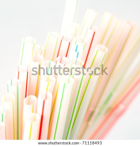 Colorful drinking straws. Close up of colored drinking straws with shallow depth of field on white background.
