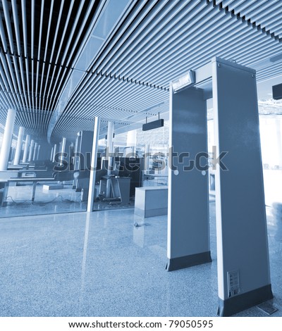 The waiting area - behind the security entrance and desk - of an airport terminal