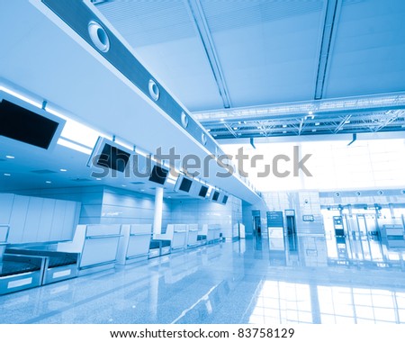 Modern interior of famous  International Airport. Security control machines and departures area.