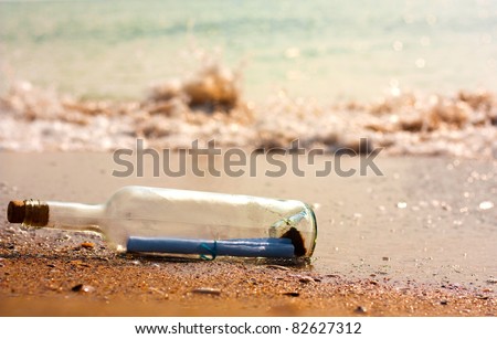 A letter or message in a bottle on the beach