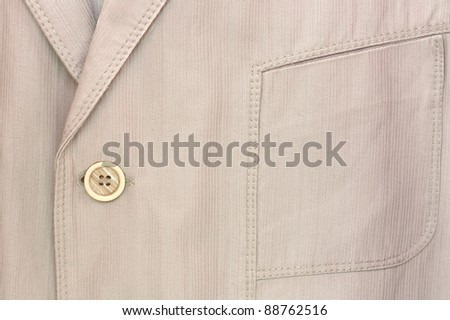 Detail of a men's elegant casual  suit.Button and pocket