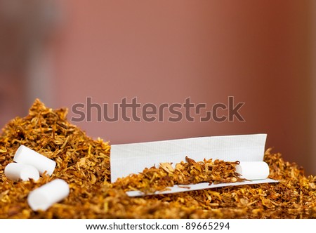 Tobacco rolling paper and filter ready to be rolled into a cigarette