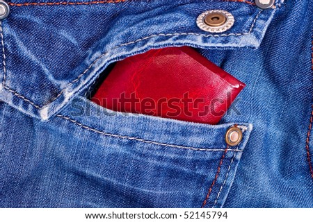 Red documents in back blue jeans pocket