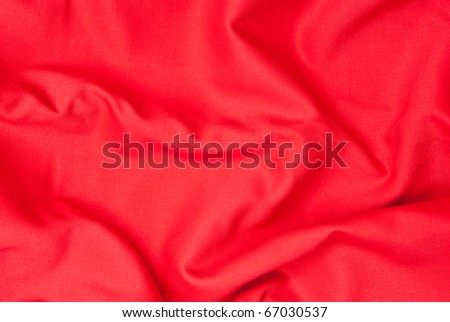 Shiny red textile background. Studio shot