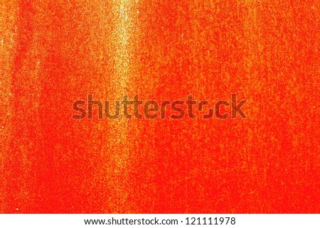 red background with patch of light