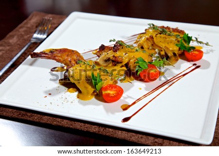 The food is cooked poultry in a restaurant
