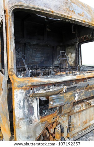 Truck cabin destroyed in fire on side of the road