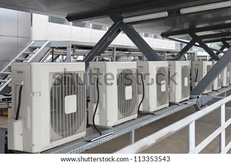 Air conditioners condenser units at building rooftop