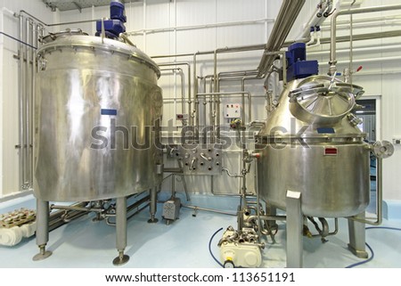 Interior of dairy factory with fermentation tank
