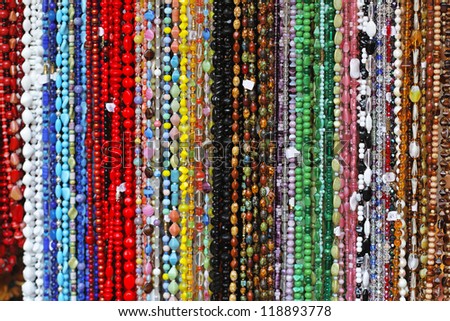 Bunch of long necklaces with colorful beads