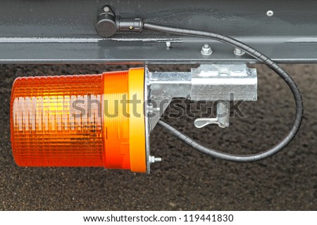 Amber warning flashing light beacon at trailer