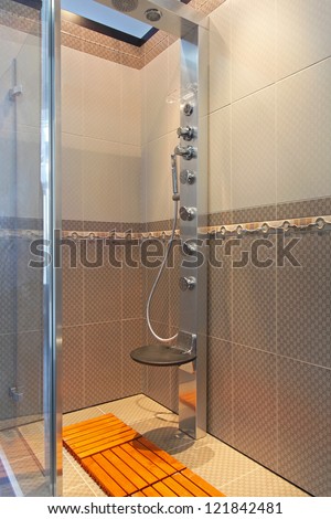 Modern shower cabin with hydro massage nozzles