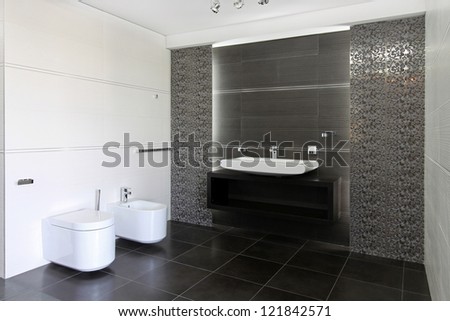 Contemporary bathroom interior in gray and white