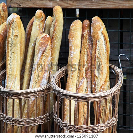 Traditional crusty French baguette bread in baskets