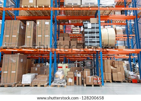 Shelving system with goods in distribution warehouse
