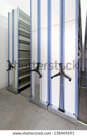 High density shelving system with mobile cabinets for documents