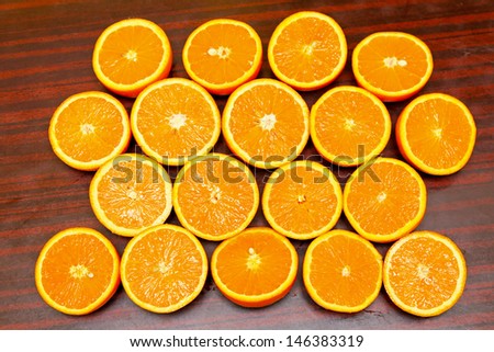 Background made from fresh oranges cut at half