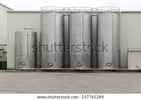 Stainless steel silo for storing bulk materials in factory