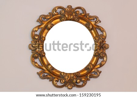 Carved gold rustic mirror at wall
