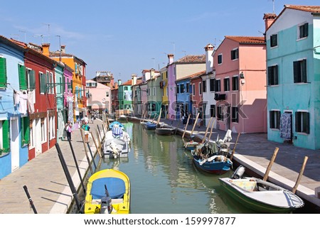 VENICE, ITALY - SEPTEMBER 24: Burano canals Venice on SEPTEMBER 24, 2009. Colorful houses and canal in Burano island Venice, Italy.