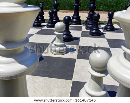 Giant chess board game set in the garden