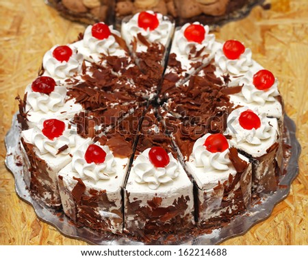 Whole cake with cherries on top