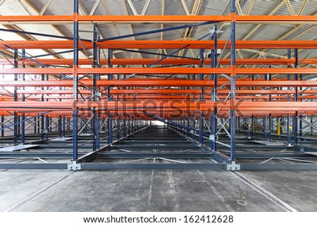 Metal shelves for pallets in distribution warehouse