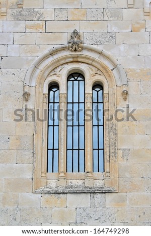 Three arch windows at medieval stone church in Montenegro