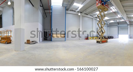 New factory hall with hydraulic scissors lift platform