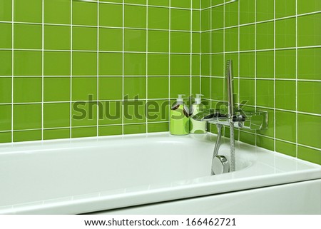 Bathtub With Modern Faucet In Green Bathroom