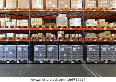 Mobile shelving system with goods in warehouse