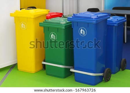 Three new plastic recycling bins for sorting waste