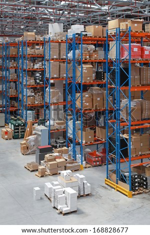 Distribution warehouse with high rack shelving system