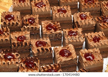 Brown chocolate cakes with jam topping
