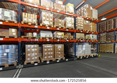 Mobile aisle racking system in distribution warehouse