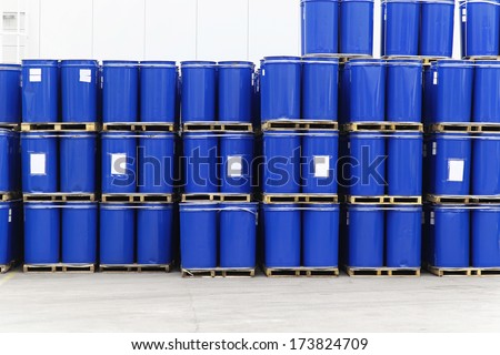 Blue steel barrels with liquid material for factory