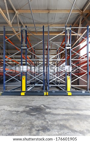Mobile roller racking system in distribution warehouse